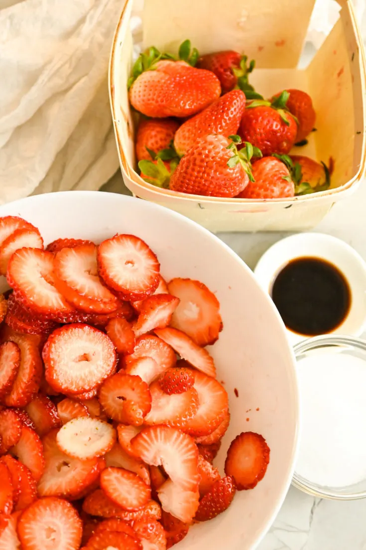 sliced strawberries ready to be mixd with sugar free sweetener and vanilla extract