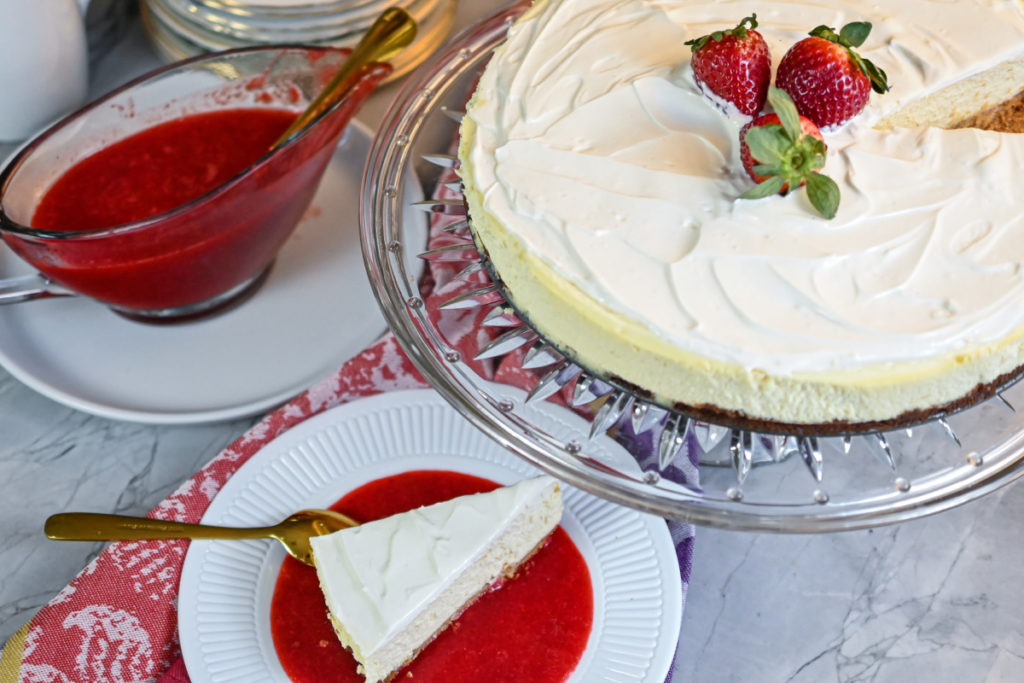 keto cheesecake with a side of fresh strawberry sauce