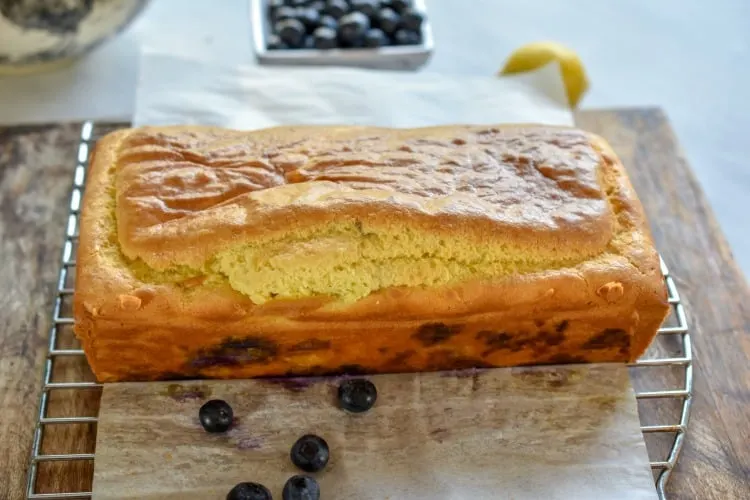 keto blueberry lemon bread resting on a baking rack