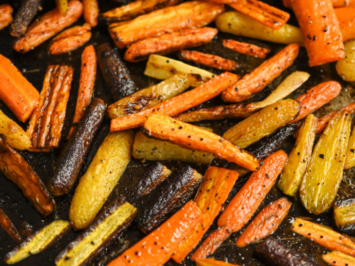 Roasted carrots ready to be tossed in sugar-free glaze