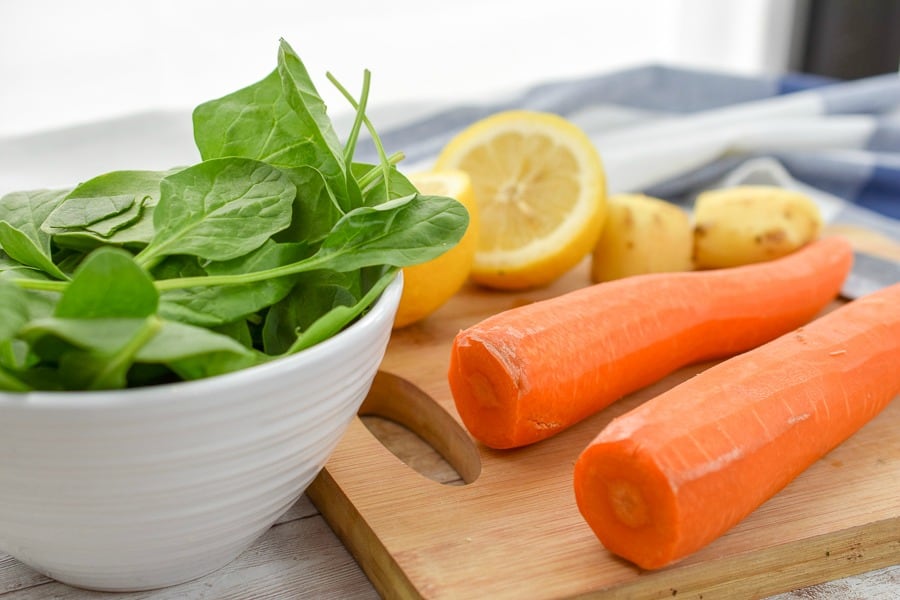 carrots, spinach, lemon and ginger root prepped and ready for keto spinach carrot juice.