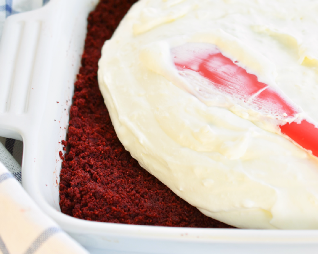 Ice cream layer being added to keto red velvet ice cream cake