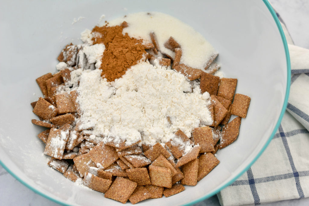 keto cinnamon toast crunch cereal being coated with cinnamon and sweetener