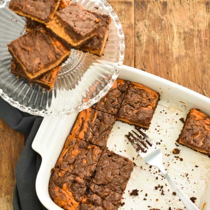 These rich Keto pumpkin cheesecake brownies are perfect for when you have a hankering for both chocolate and pumpkin and can't decide between the two. The fact that they are low in carbs, sugar-free, gluten and grain-free makes them a great treat for anyone doing a ketogenic diet. 