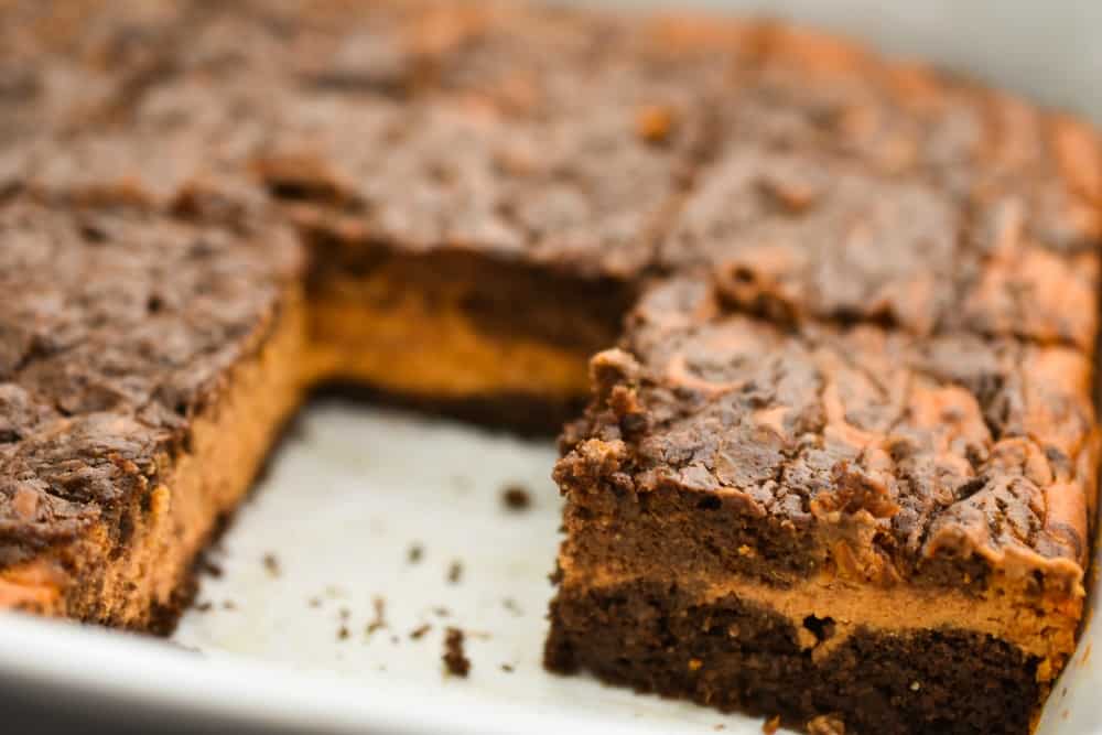 These rich Keto pumpkin cheesecake brownies are perfect for when you have a hankering for both chocolate and pumpkin and can't decide between the two. The fact that they are low in carbs, sugar-free, gluten and grain-free makes them a great treat for anyone doing a ketogenic diet. 