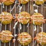 keto cream cheese pumpkin cookies on baking rack glazed