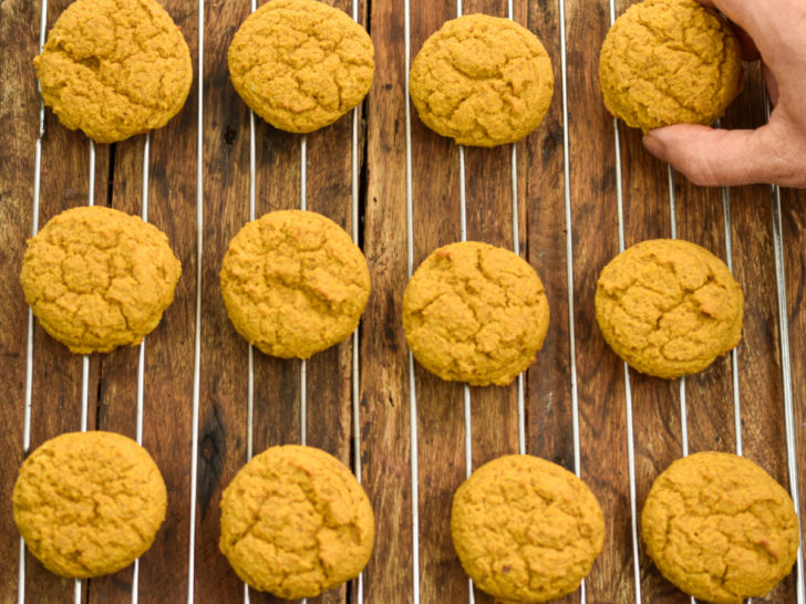 low carb pumpkin cookies cooling on a cooling rack before icing is applied