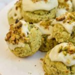 keto pistachio cookies on a white stand