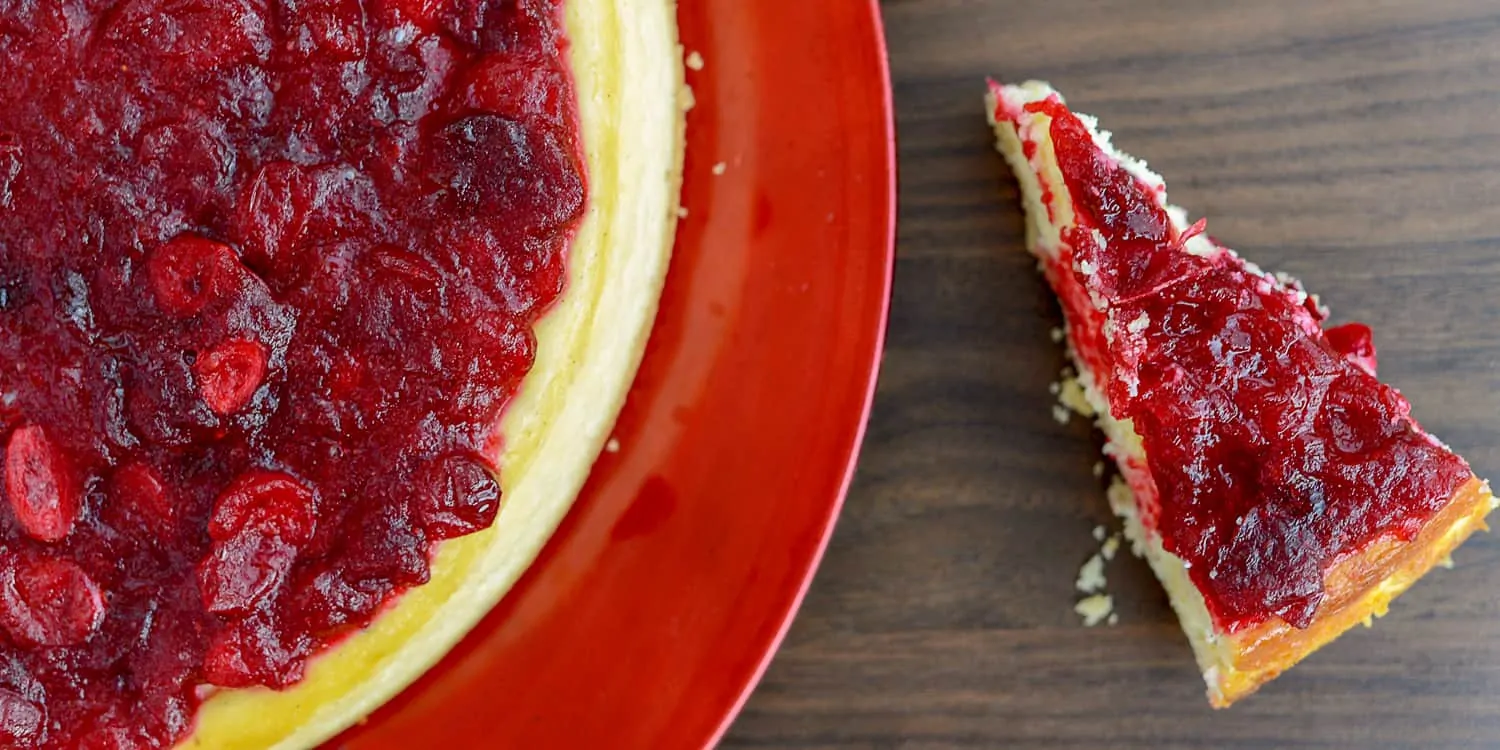 keto cranberry cheesecake on a red plate