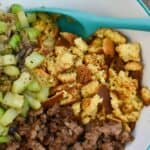 keto stuffing being mixed in a white and blue bowlketo stuffing being mixed in a white and blue bowl