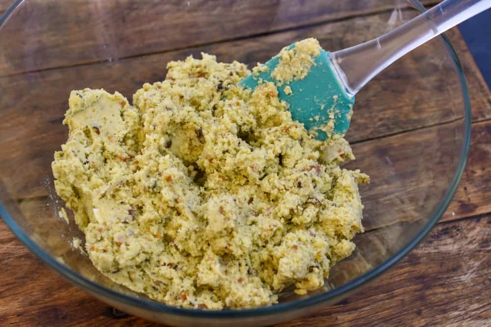 keto pistachio cookie batter in a clear bowl