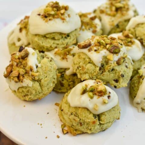 keto pistachio cookies on a white stand