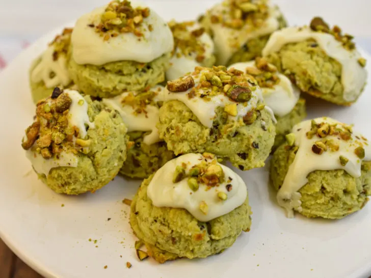 Best keto pistachio cookies on white plate stand