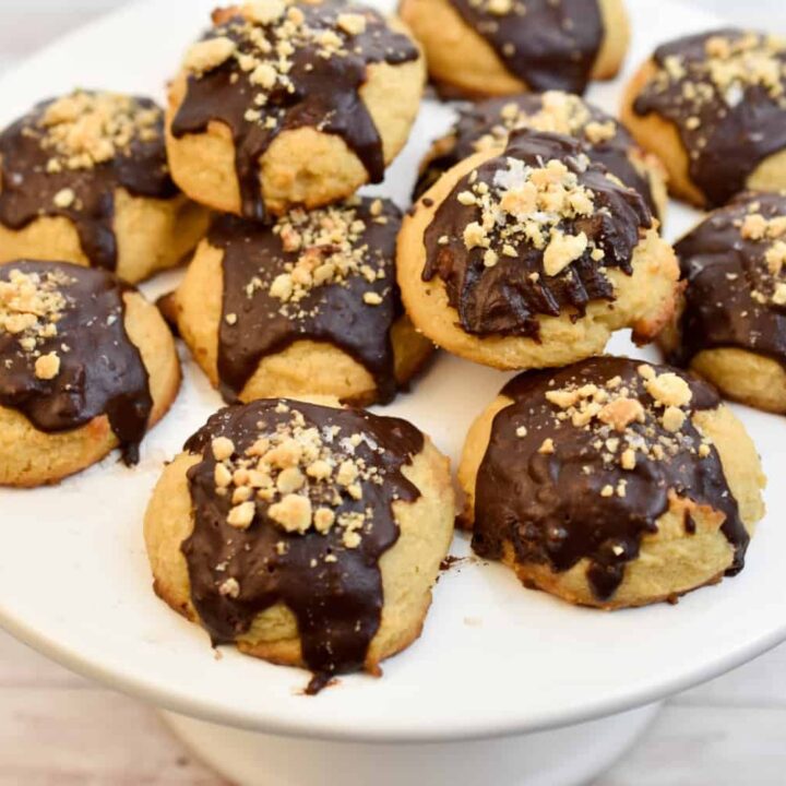 keto peanut butter coconut flour cookies on a cake stand