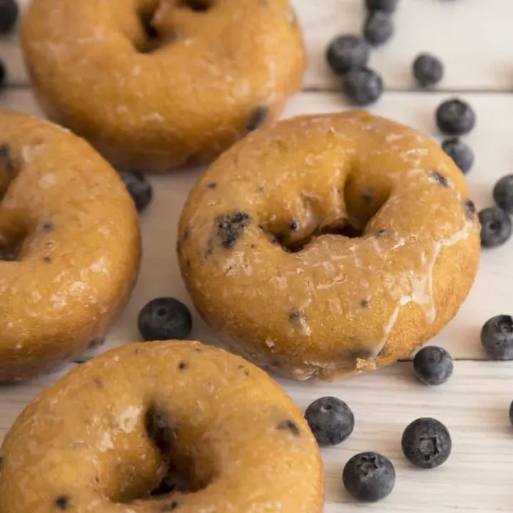 Keto blueberry donuts on wood counter