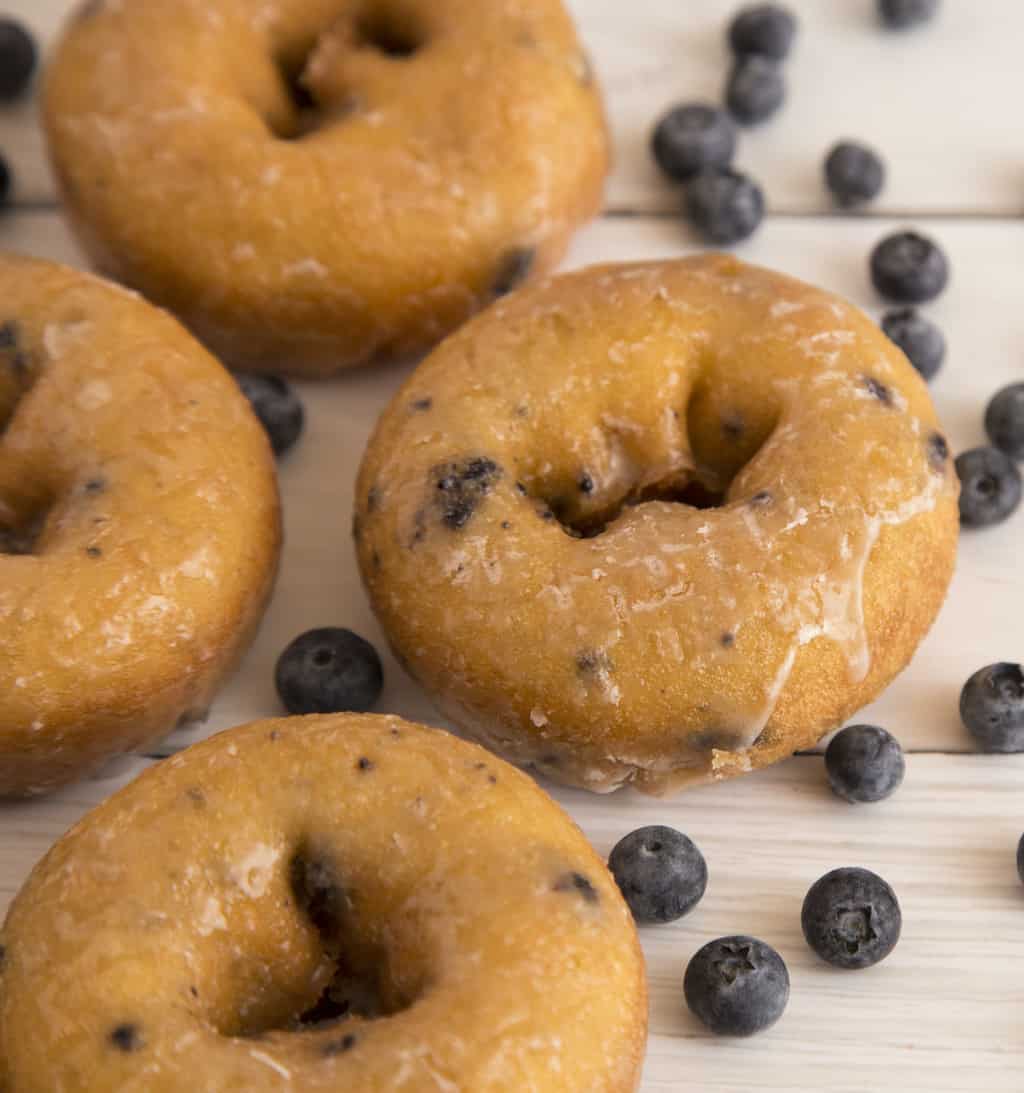 Keto blueberry donuts on wood counter