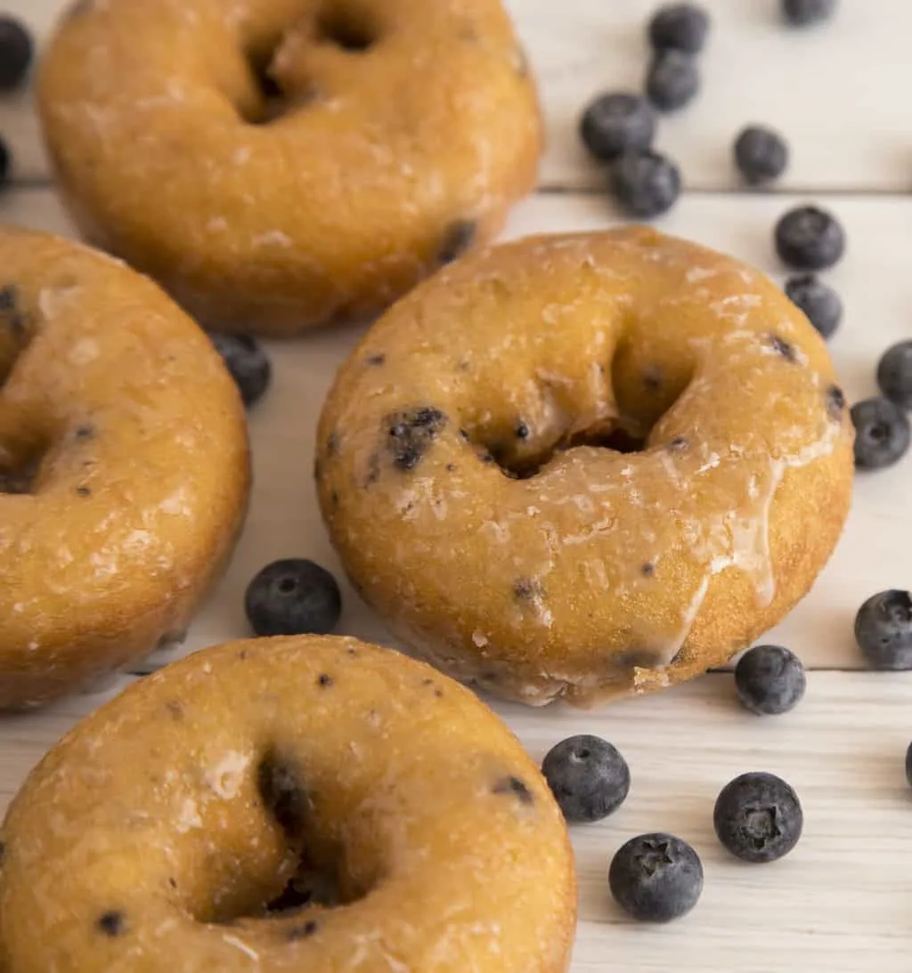 Keto blueberry donuts on wood counter