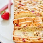 keto strawberry rhubarb bread sliced on a white plate