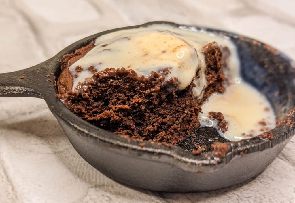 coconut flour keto brownie a la mode in a skillet mini with ice cream melted