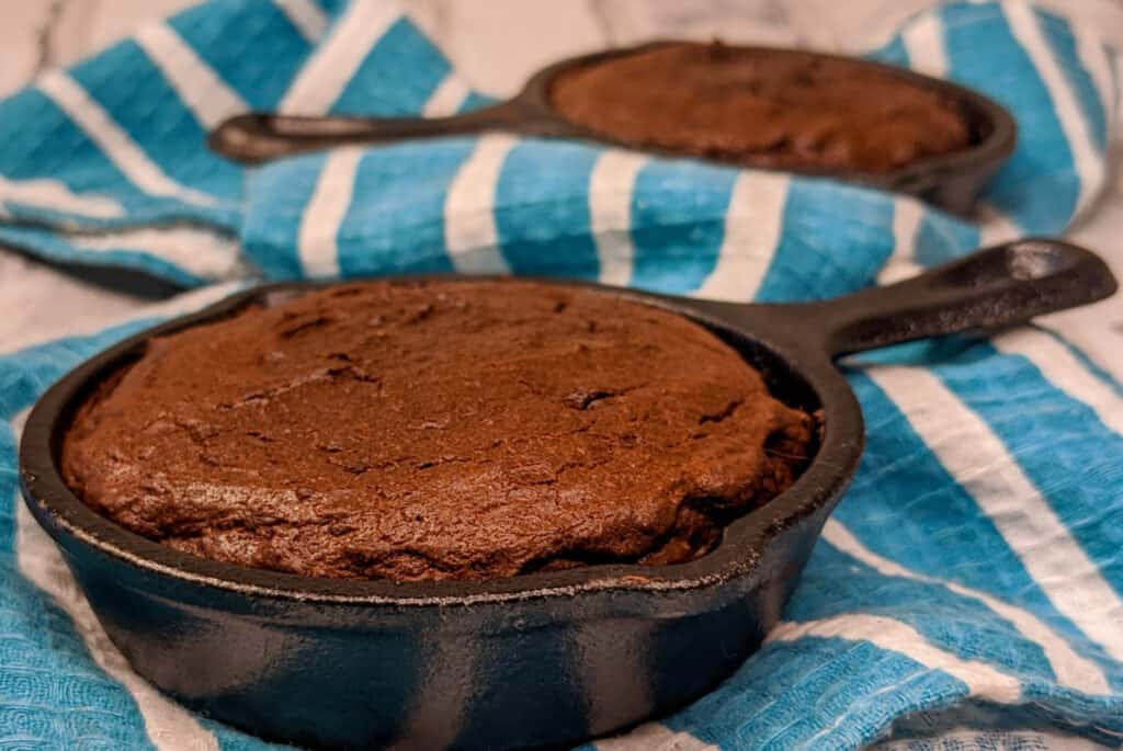 keto skillet coconut flour brownies baked in minis on a white and blue dish cloth