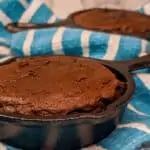 keto skillet coconut flour brownies baked in minis on a white and blue dish cloth