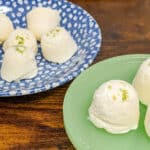 keto key lime cheesecake fat bombs on a blue poke dot plate and a small green stand