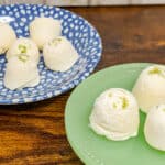 keto key lime cheesecake fat bombs on blue and white small plate and small green stand
