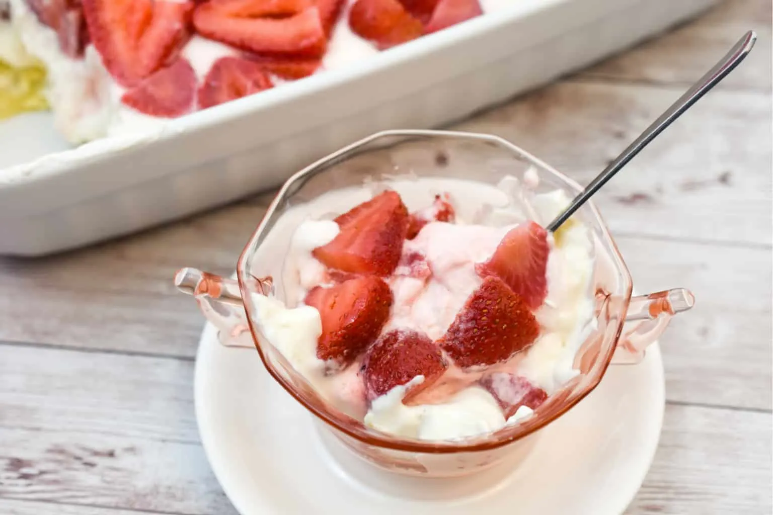 keto no bake strawberry cheesecake served in a light pink cup
