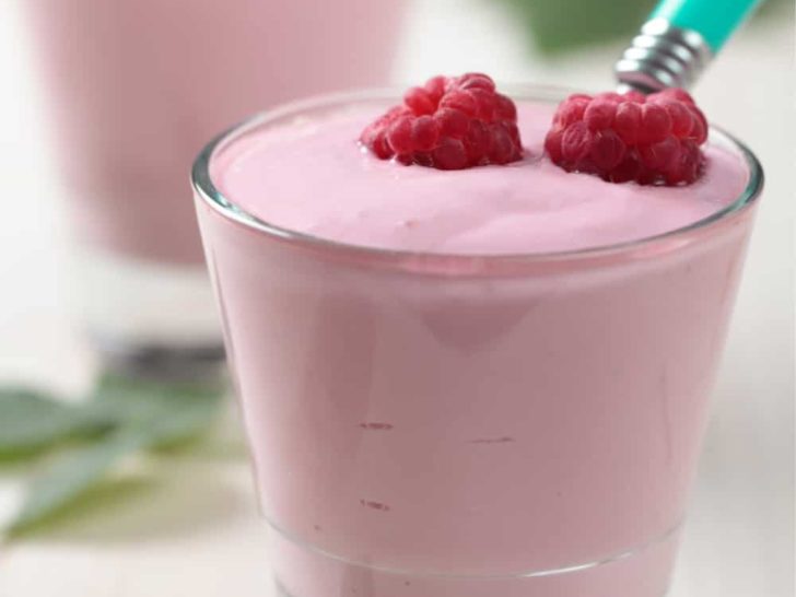 Keto raspberry lemondade cheesecake fluff served in small clear glass cups