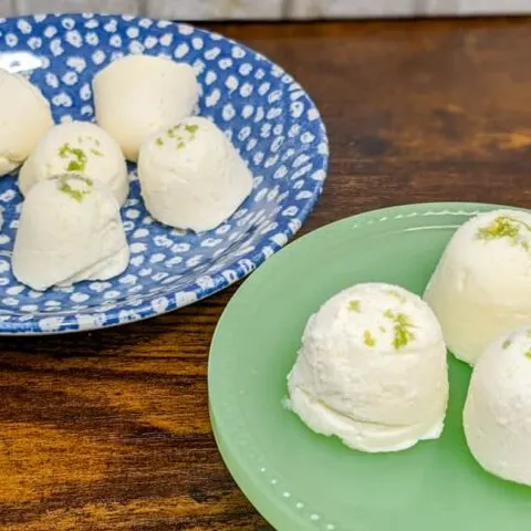 key lime cheesecake fat bombs on stand and plate