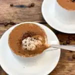 upclose individual keto tiramisu cheesecakes in a coffee cup