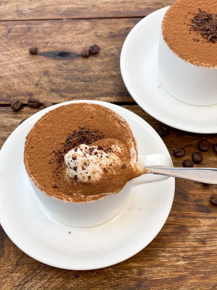 upclose individual keto tiramisu cheesecakes in a coffee cup