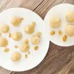 Cream Cheese Peanut Butter Fat Bombs on White Plates with Peanuts