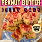 Keto Peanut Butter Jelly Bars on a clear cake stand