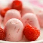 Keto Raspberry Cheesecake Fat Bombs with Raspberries Up Close