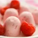 Keto Raspberry Cheesecake Fat Bombs with Raspberries Up Close