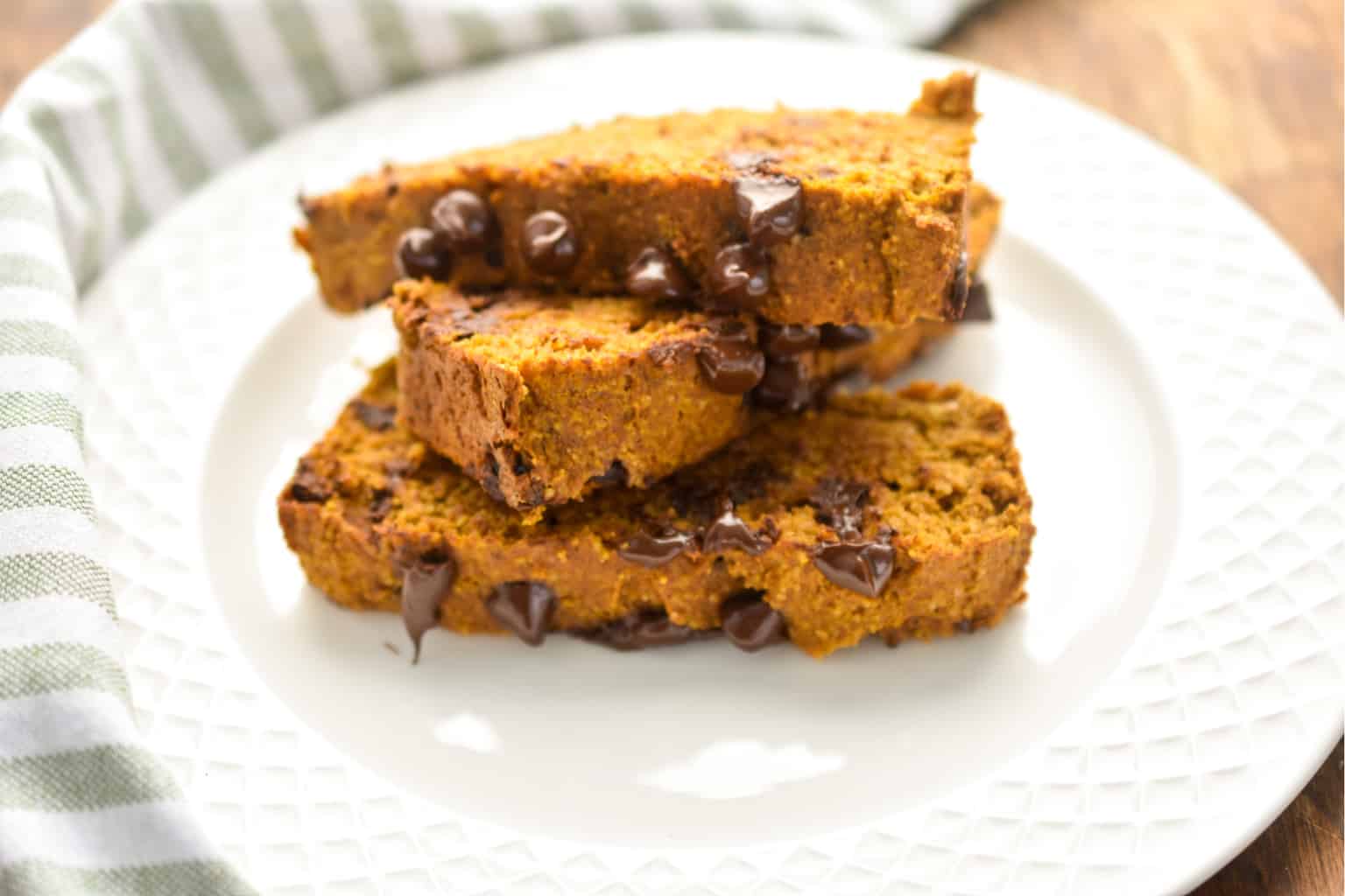 keto pumpkin chocolate chip bread three slices on a white plate