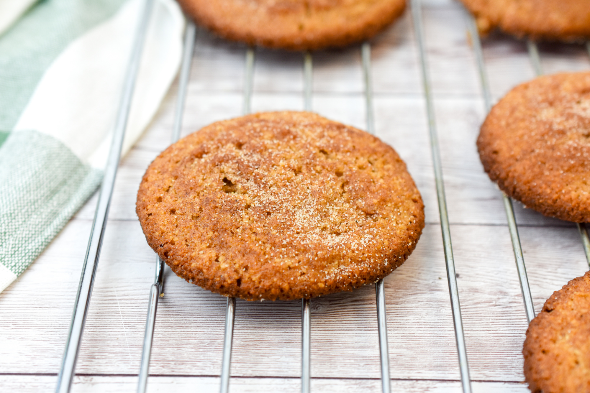 keto snickerdoodle cookies close up on a baking rack