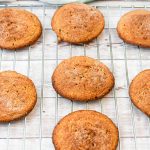 keto snickerdoodle cookies on a baking rack cooling