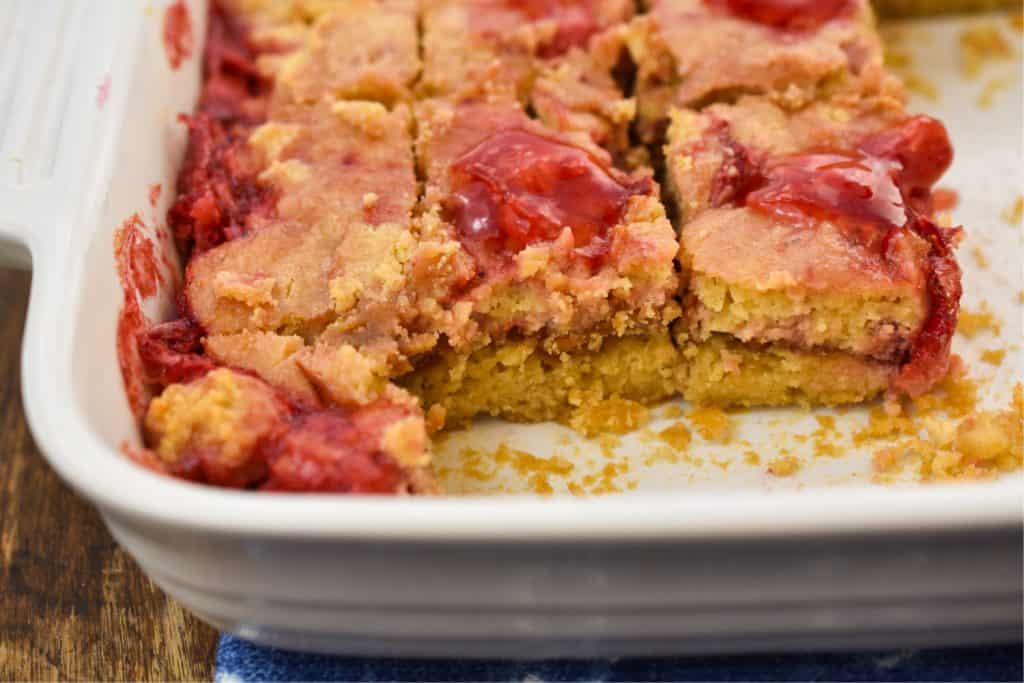 low carb peanut butter jelly barrs in a white pan