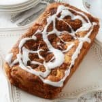 keto cinnamon swirl bread with vanilla icing on table from above