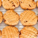 keto peanut butter chocolate chip cookies cooling on a baking rack