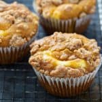 keto pumpkin cheesecake muffins cooling on a baking rack