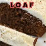 Keto gingerbread loaf sliced on a white plate