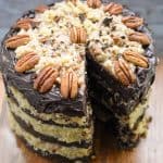 keto German Chocolate Cake on wood cake stand