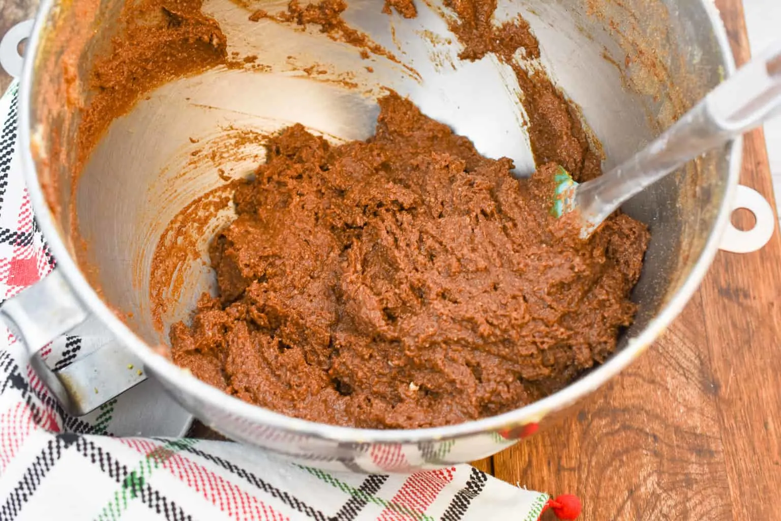 Keto gingerbread loaf batter being mixed in a metal bowl