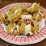 keto pumpkin cranberry cookies on a white and red plate