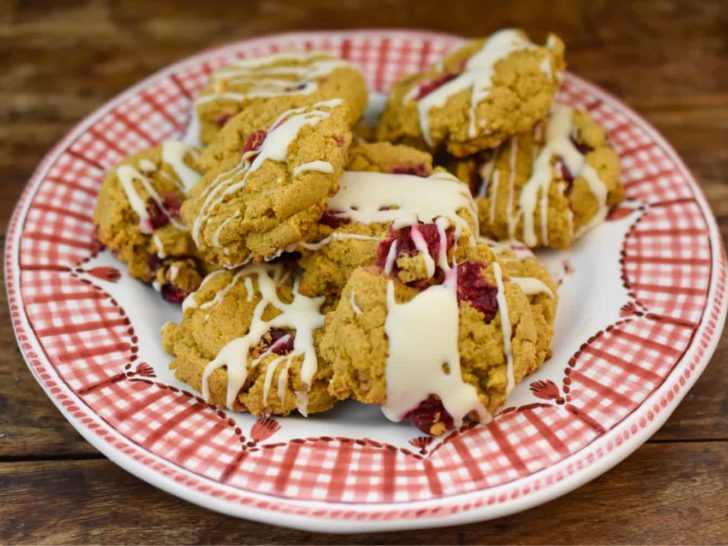 keto pumpkin cranberry cookies on a white and red plate