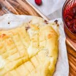Keto Baked Brie On Cheese Board With Cranberry Sauce On The Side