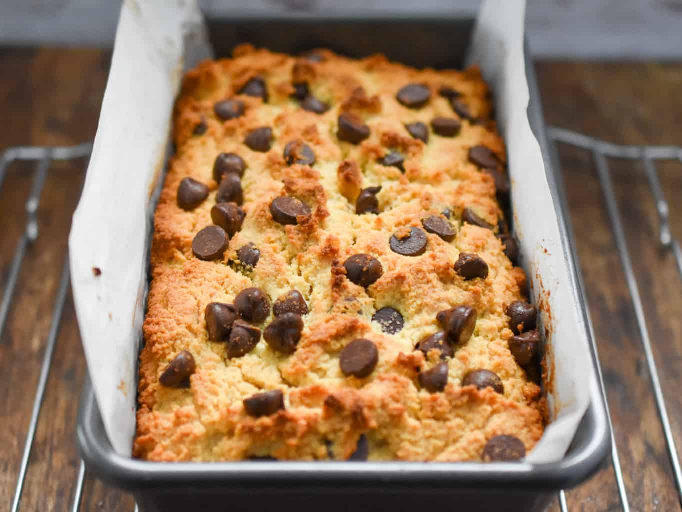 keto chocolate chip pound cake baked and cooling on a baking rack